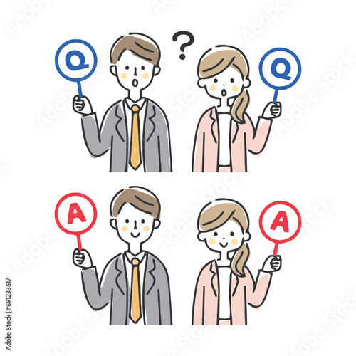 Q&Aの札を持つビジネスの男女