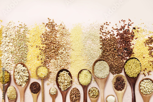 Colorful mix of grain varieties: oat and wheat, rice and millet, buckwheat and barley, quinoa and polenta. Food ingridients background photo