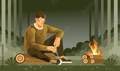 Young Man Sitting at a Campfire