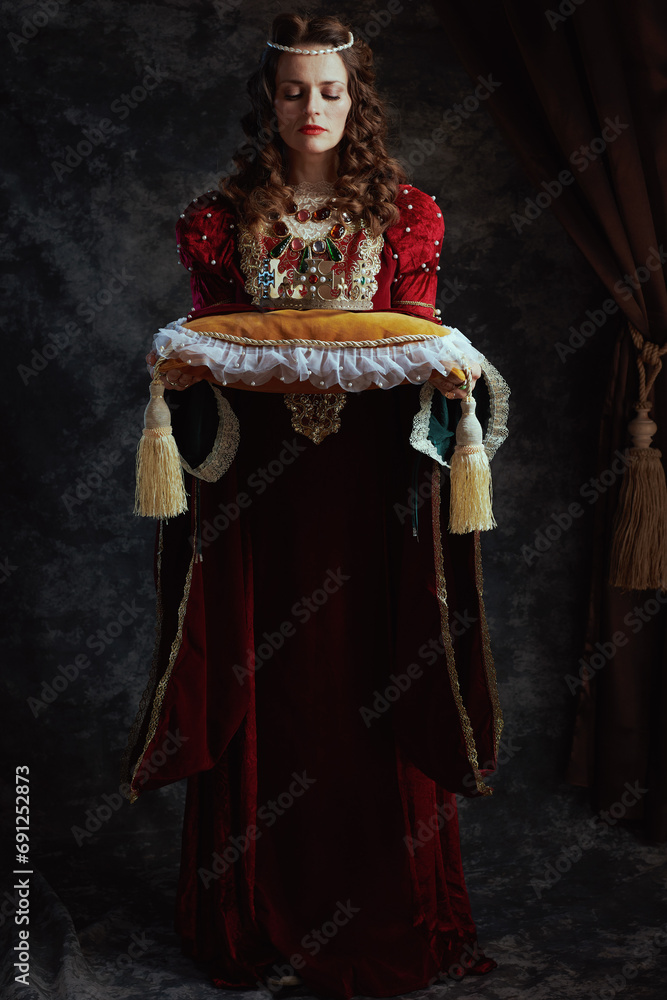 Full length portrait of medieval queen in red dress