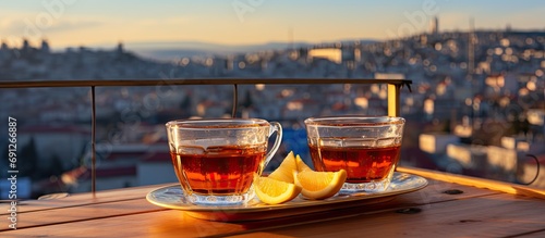 Turkish tea on rooftop fence overlooking Istanbul. photo