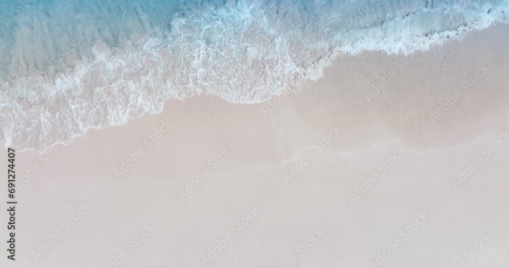 Beach Wave water in the Tropical summer beach with  sandy beach background