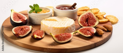 Trendy food: Fresh figs, fig jam, spicy jelly, and chili threads on a butter board.