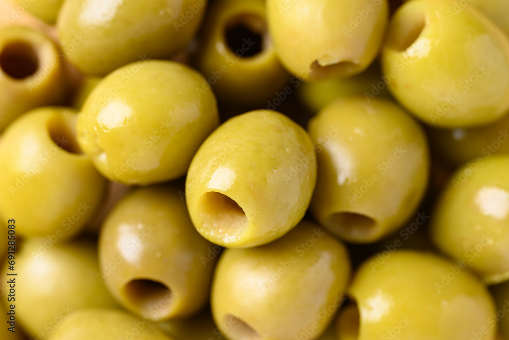 Pickled olives, Pitted green olives texture background Pickled olives, Pitted green olives texture background