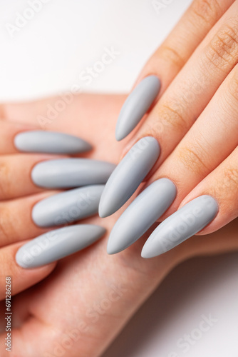 Woman's hand with grey nail polish