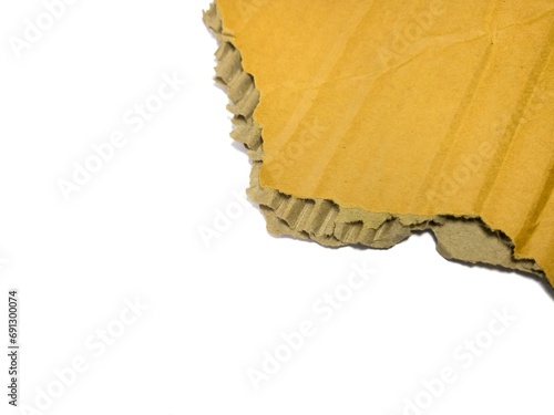 Piece of torn cardboard isolated on white