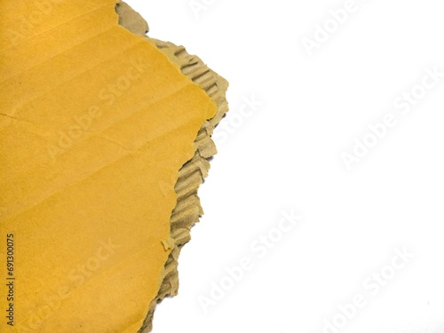 Piece of torn cardboard isolated on white