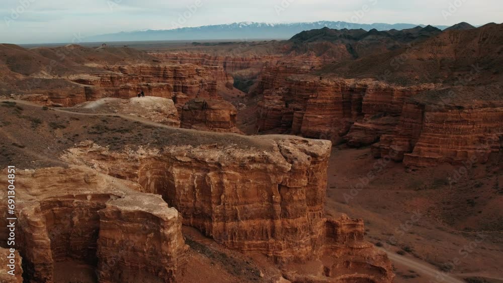 Charyn canyon in sunny weather. Aerial view. Summer. National Park in Almaty, Kazakhstan. Orange rocks and blue sky Charyn canyon in sunny weather. Aerial view. Summer. National Park in Almaty, Kazakhstan. Orange rocks and blue sky