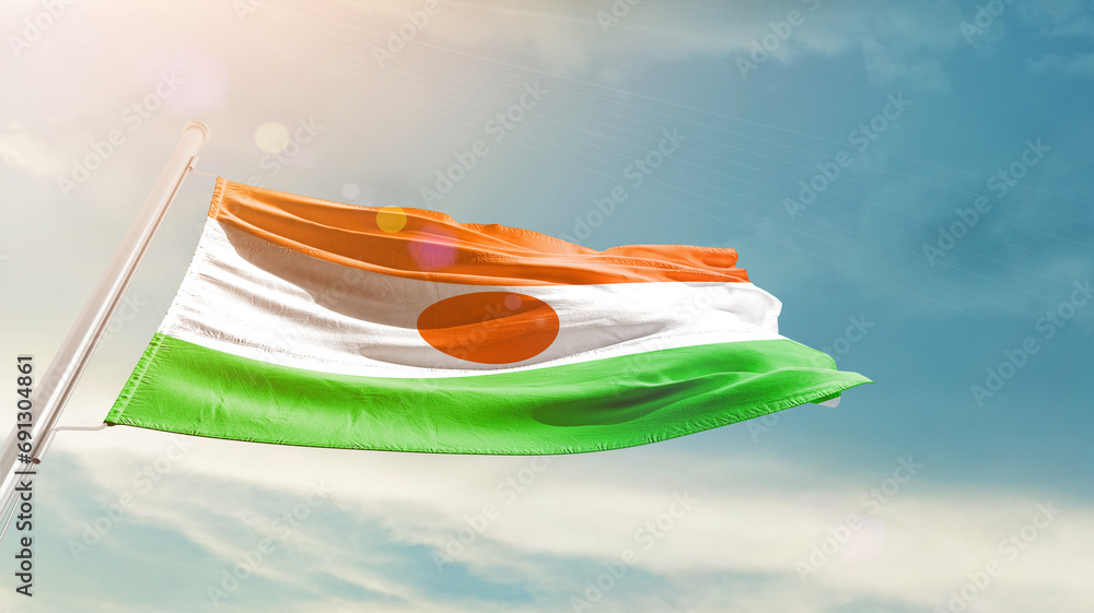 Niger national flag cloth fabric waving on the sky - Image