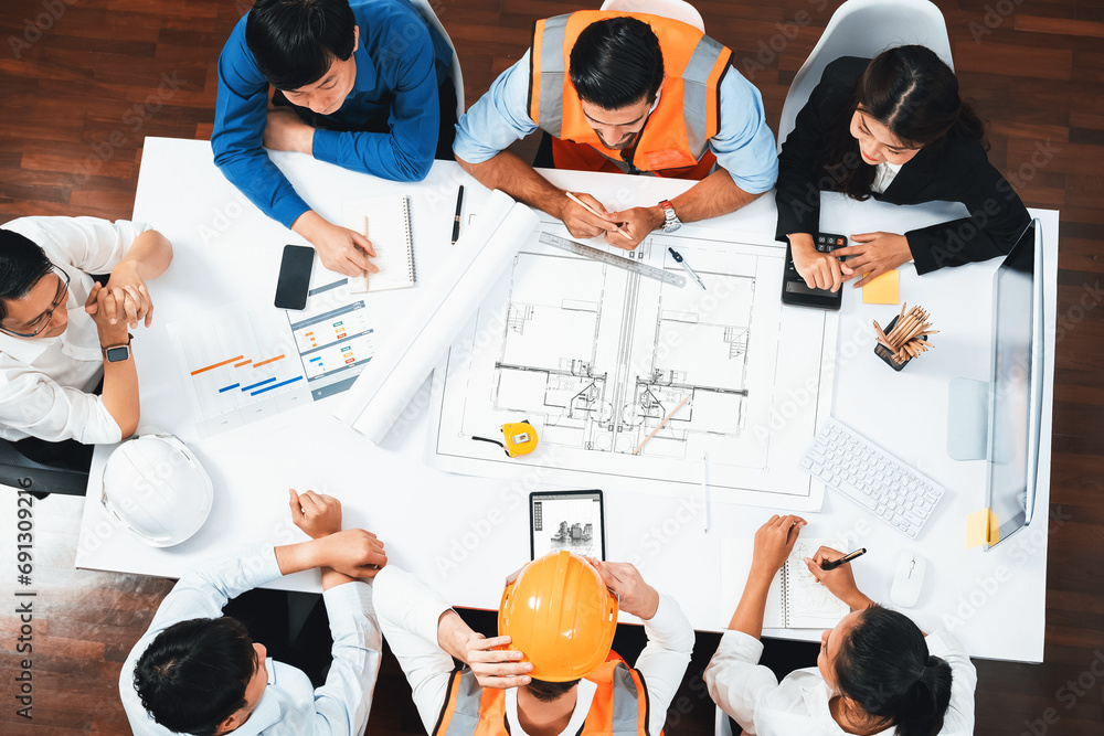 Top view banner of diverse group of civil engineer and client working together on architectural project, reviewing construction plan and building blueprint at meeting table. Prudent - obrazy, fototapety, plakaty 