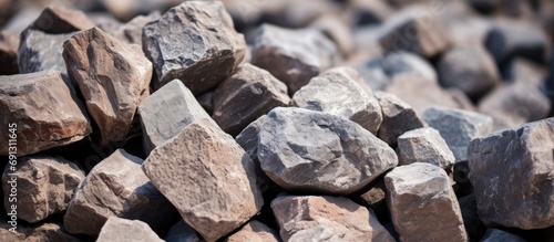 Clinker stones piled up at a cement plant, close-up.