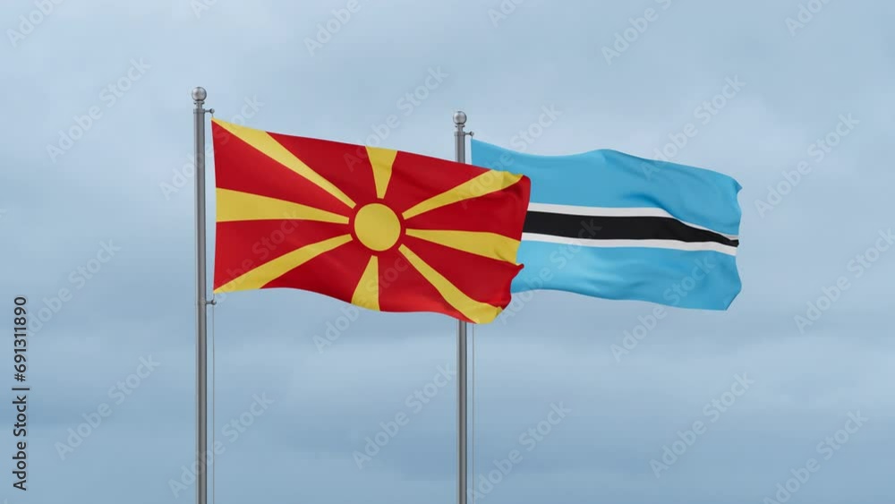Botswana flag and North Macedonia flag waving together on cloudy sky, endless seamless loop, two country relations concept Botswana flag and North Macedonia flag waving together on cloudy sky, endless seamless loop, two country relations concept