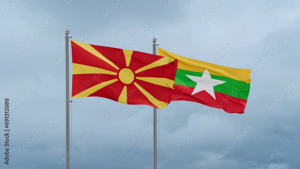 Myanmar aka Burma flag and North Macedonia flag waving together on cloudy sky, endless seamless loop, two country relations concept Myanmar aka Burma flag and North Macedonia flag waving together on cloudy sky, endless seamless loop, two country relations concept