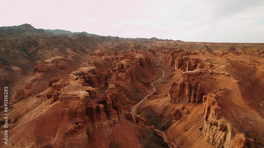 Aerial view of the Amazing Canyon in Central Asia. Mountain ranges in a fabulous canyon at sunset aerial view. Charyn Canyon, Kazakhstan. Hiking concept