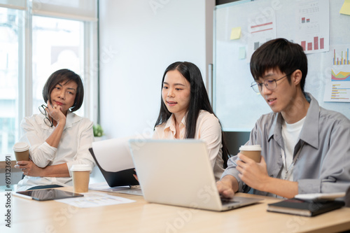 Group of professional Asian businesspeople are in the meeting, brainstorming and discussing.