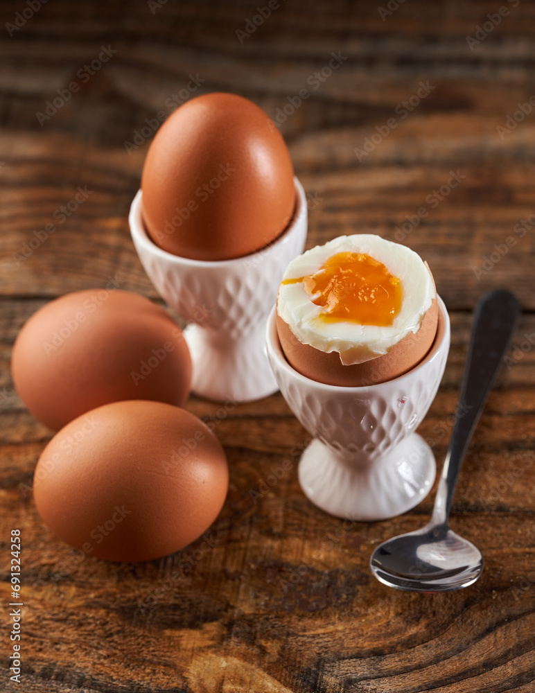 Soft boiled eggs on a wooden board Soft boiled eggs on a wooden board
