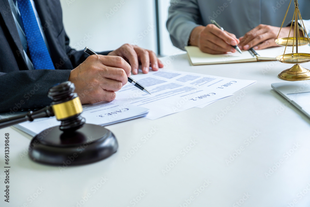 Two attoneys or lawyers viewing documents. Two attoneys or lawyers viewing documents.