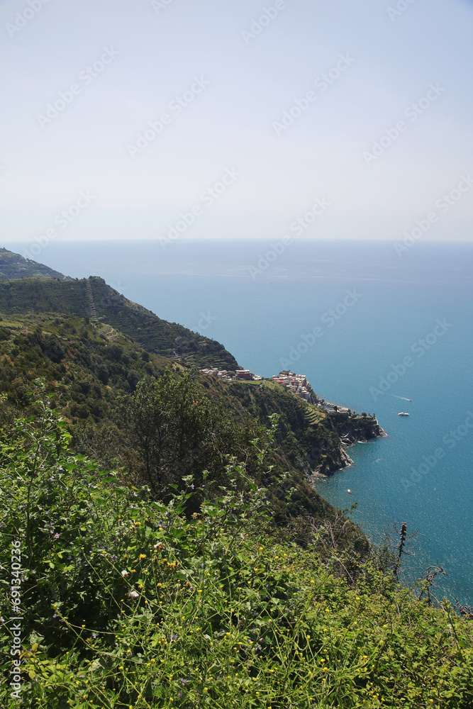The panorama of CInque Terre national park and Corniglia village, Italy The panorama of CInque Terre national park and Corniglia village, Italy