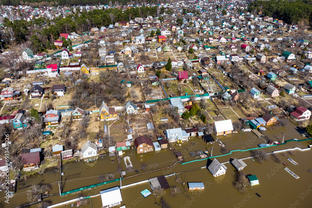 Aerial view of village areas with houses flooded during a rural spring river flood