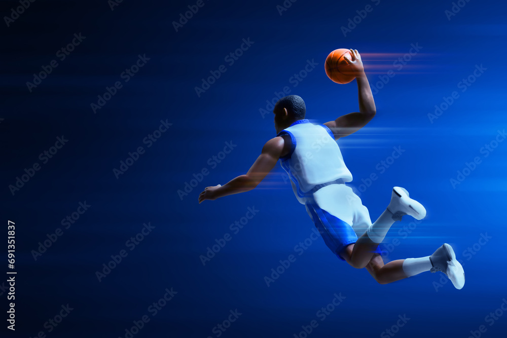 3d illustration young professional basketball player slam dunk on dark blue background 3d illustration young professional basketball player slam dunk on dark blue background