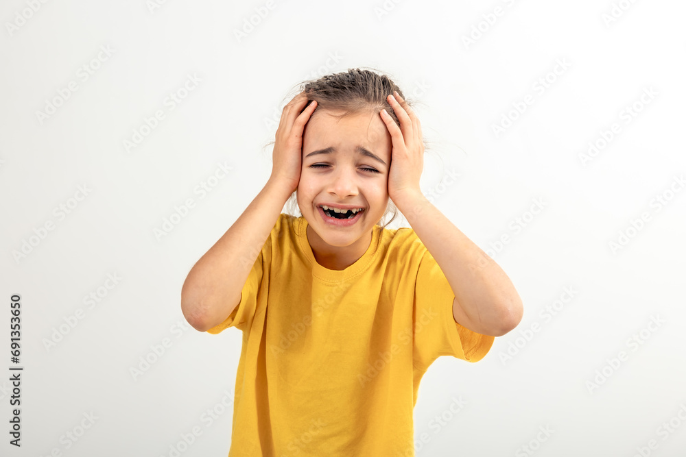 Little desperate girl looking panic, holding her head with both hands. Little desperate girl looking panic, holding her head with both hands.