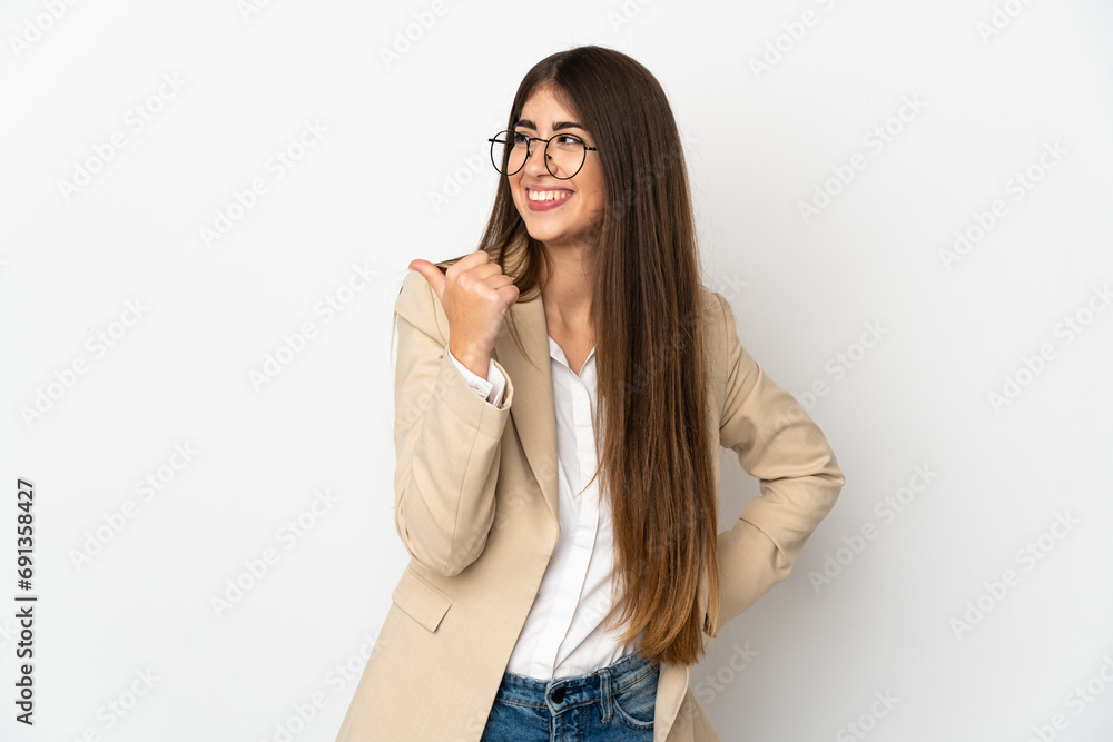 Young caucasian woman isolated on white background pointing to the side to present a product Young caucasian woman isolated on white background pointing to the side to present a product