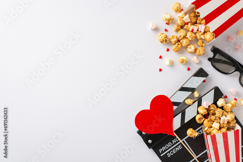 Valentine's film fest at home: Top view of clapperboard, 3D glasses, popcorn, heart decor, marshmallow, and sprinkles on a sweet white surface. Romantic ambiance for a perfect night