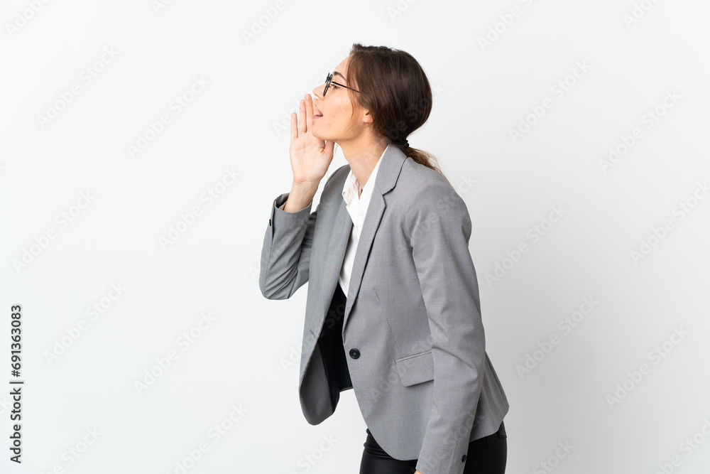Business Ireland woman isolated on white background shouting with mouth wide open to the side Business Ireland woman isolated on white background shouting with mouth wide open to the side