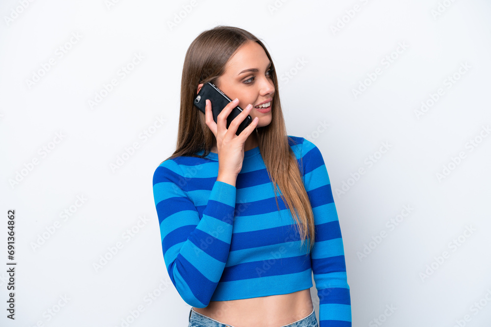 Young caucasian woman isolated on white background keeping a conversation with the mobile phone with someone