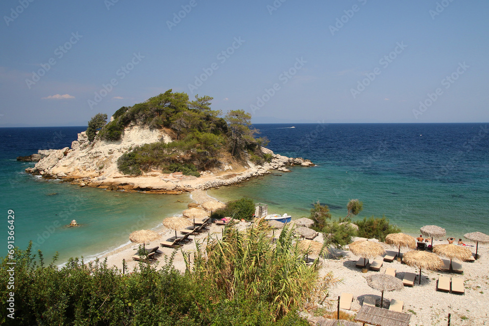 Sunrise beach  with crystal clear water in the traditional Greek fishing village of Kokarri on the island of  Samos