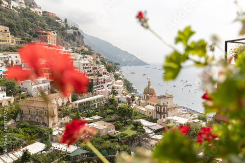 Italy, Campania, Positano, Hillside village onAmalfiCoast with flowers in foreground photo