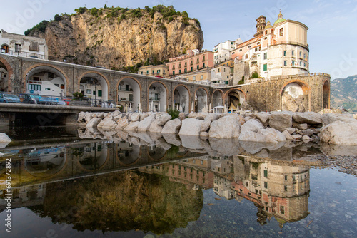 Italy, Campania, Atrani, Village on Amalfi Coast with cliff in background photo