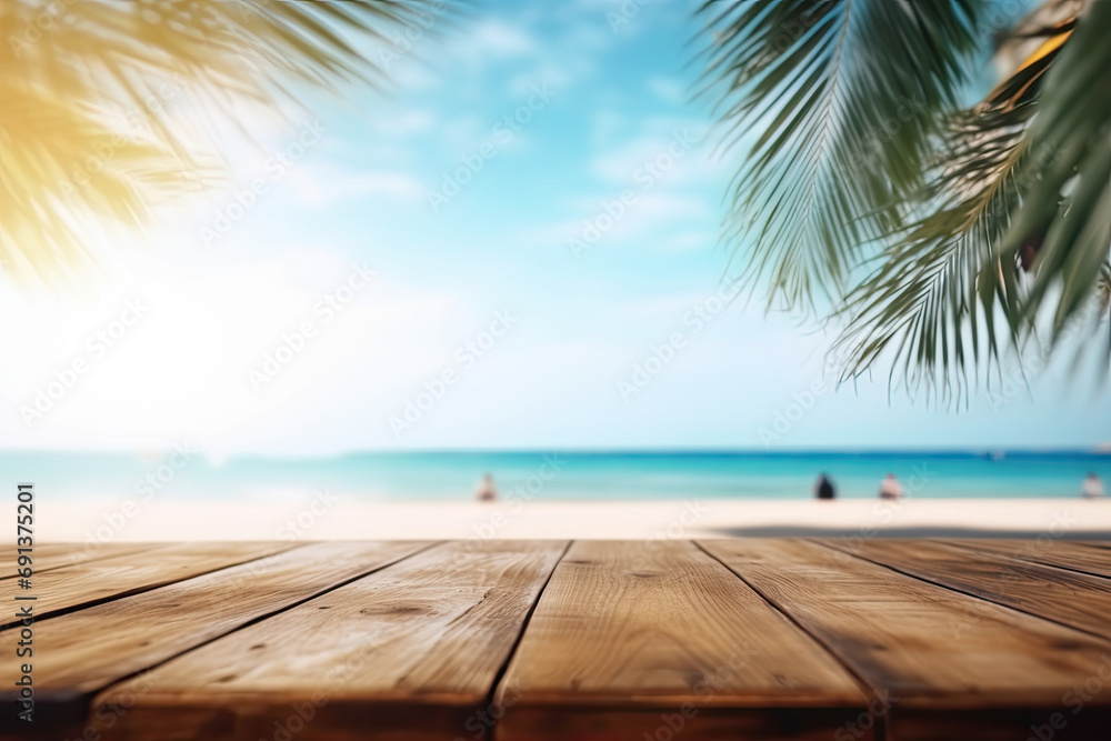 Empty wooden table and palm leaves with party on beach blurred background and beautiful sea 