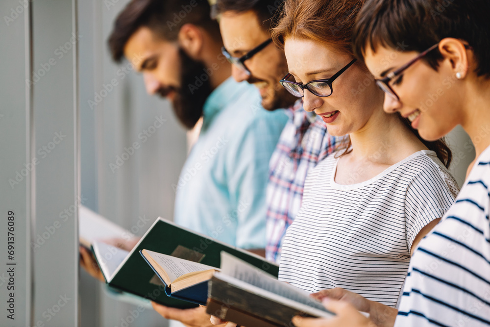 Students studying in library. Young success people are spending time together and learning together. Students studying in library. Young success people are spending time together and learning together.