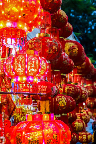 Many red lanterns with vietnamese language translated as  Happy New Year  hanging in Vietnam for Tet Lunar New Year