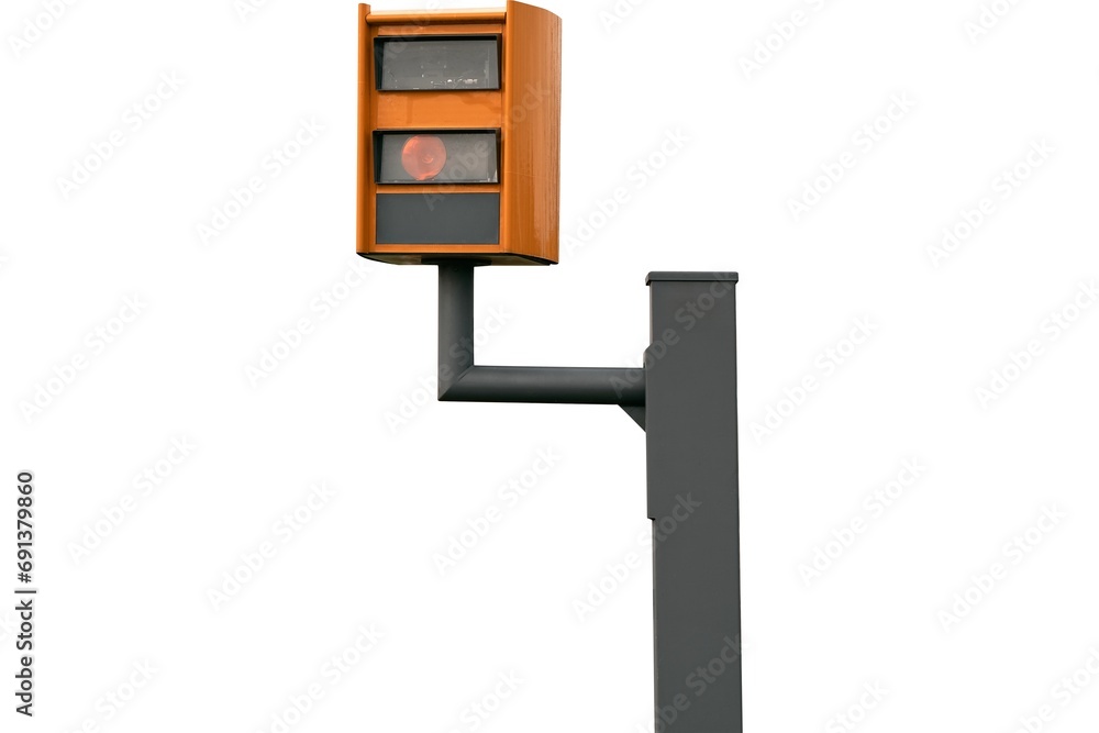 A yellow speed camera flashes as it detects a speeding car on a highway ...