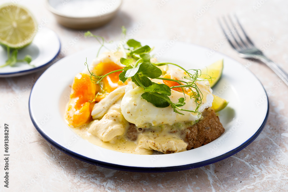 Traditional eggs Benedict with avocado Traditional eggs Benedict with avocado