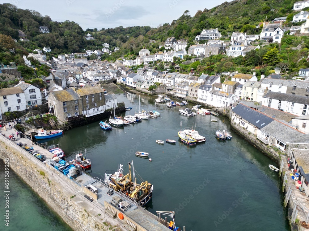 Polperro fishing village and harbour with fishing boats Cornwall UK drone,aerial