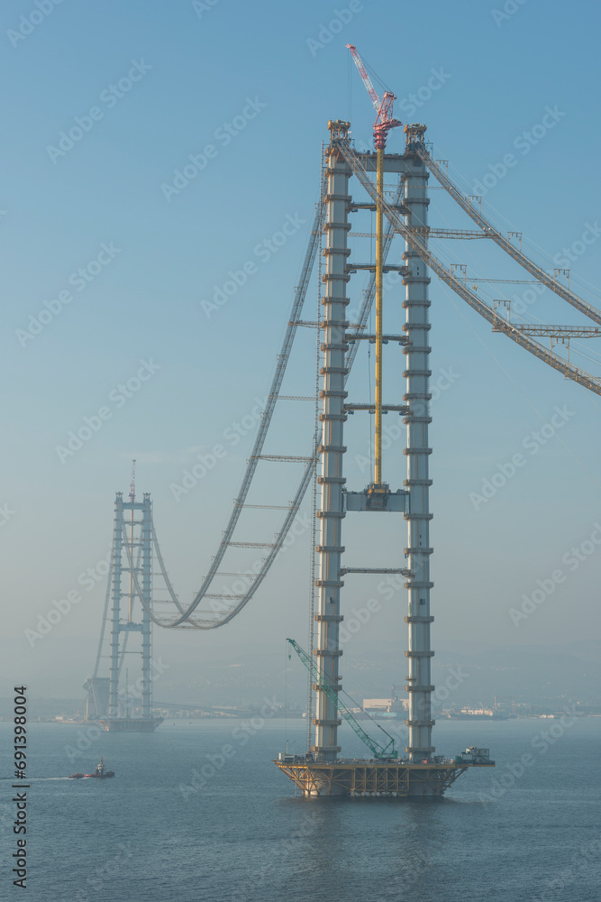 Osman Gazi Bridge (Izmit Bay Bridge). Izmit, Kocaeli, Turkey. Construction of a new road bridge continues across the Marmara Sea. Osman Gazi Bridge (Izmit Bay Bridge). Izmit, Kocaeli, Turkey. Construction of a new road bridge continues across the Marmara Sea.