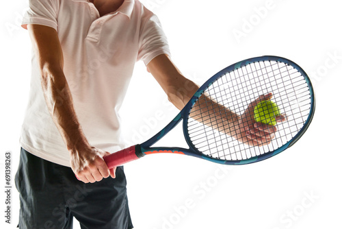 Cropped image of man, tennis player in sportswear holing racket and ball isolated over white background. Equipment. Concept of sport, hobby, active and healthy lifestyle, competition © master1305