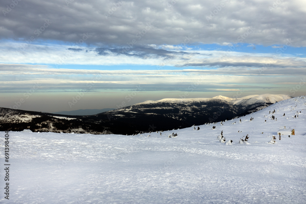 View of winter mountain landscape with beautiful sky View of winter mountain landscape with beautiful sky