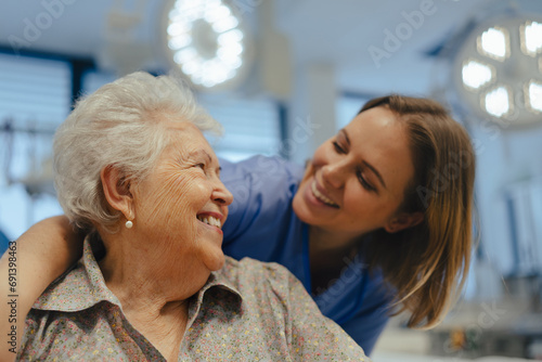 Wallpaper Mural Portrait of nurse and senior patient talking in hospital corridor. Emotional support for elderly woman. Torontodigital.ca