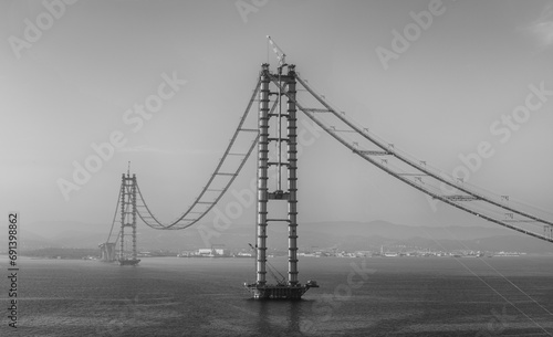 Osman Gazi Bridge (Izmit Bay Bridge). Izmit, Kocaeli, Turkey. Construction of a new road bridge continues across the Marmara Sea. photo