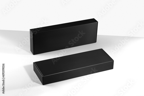 Mockup of black shallow boxes of smooth cardboard without logo