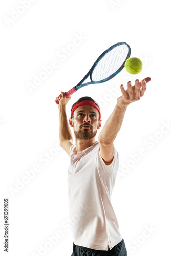 Portrait of man, concentrated tennis player in sportswear standing with tennis racket and ball isolated over white background. Concept of sport, hobby, active and healthy lifestyle, competition © master1305