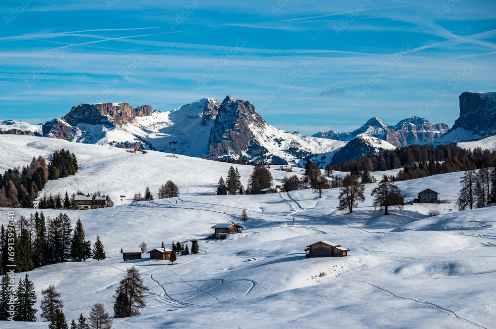 The largest high altitude plateau in Europe in winter. Snow and winter atmosphere on the Alpe di Siusi. Dolomites.