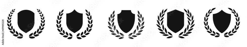 Shield with wreath silhouettes. Protection symbols. Shield vector icons. Laurel wreath and shields.
