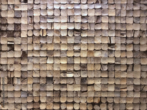 close up view of coconut shell in mosaic wall tiles pattern design for decoration