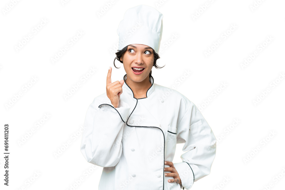 Young chef Argentinian woman over isolated background thinking an idea pointing the finger up