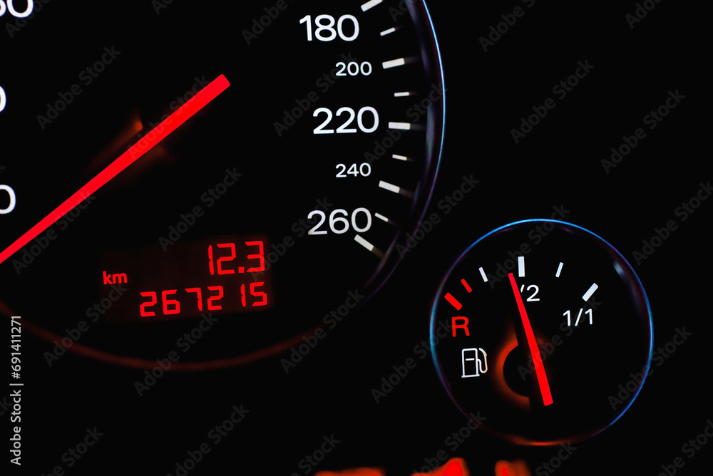 Car's dashboard.Modern car dashboard panel at night time.Closeup,selective focus.